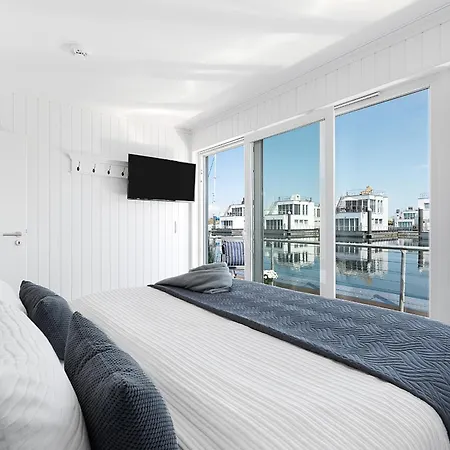 Ferienhaus Harbour View Marina: Dachterrasse, Meerblick, Sauna, Bootsanleger Olpenitz